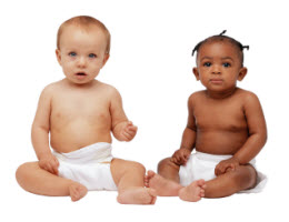 Photo of two babies, seated.