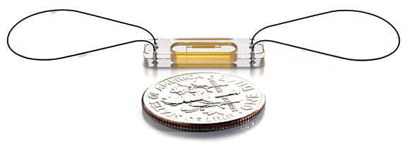An image of the CardioMEMS Heart Failure Sensor is pictured positioned a dime to represent the size of the device.